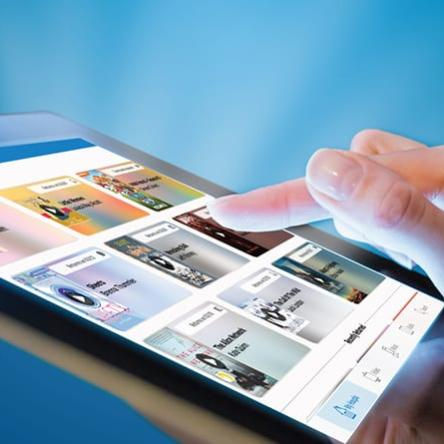 A person tapping an icon on a tablet screen.